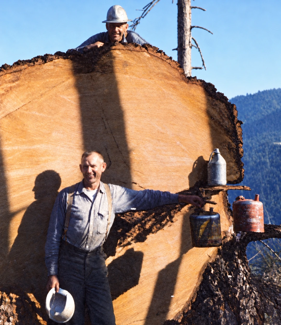 Wayne Lien and a fellow logger beside the enormous tree described in his handwritten report